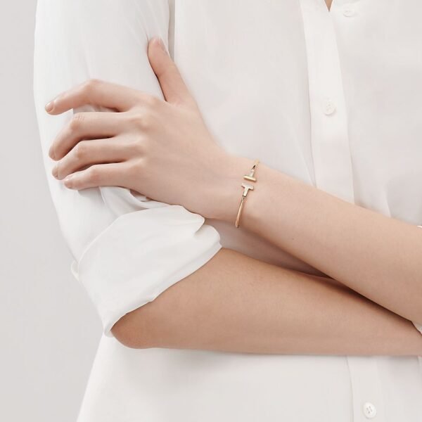 yellow gold mother of pearl T bangle bracelet