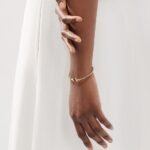 yellow gold diamond T bangle bracelet