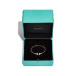 yellow gold mother of pearl T bangle bracelet