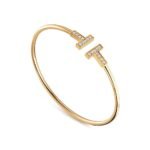 yellow gold diamond T bangle bracelet
